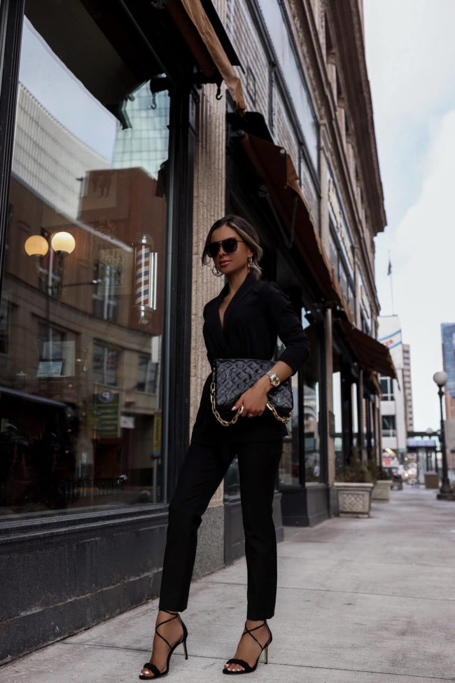 fashion blogger mia mia mine wearing a black suit and lv bag