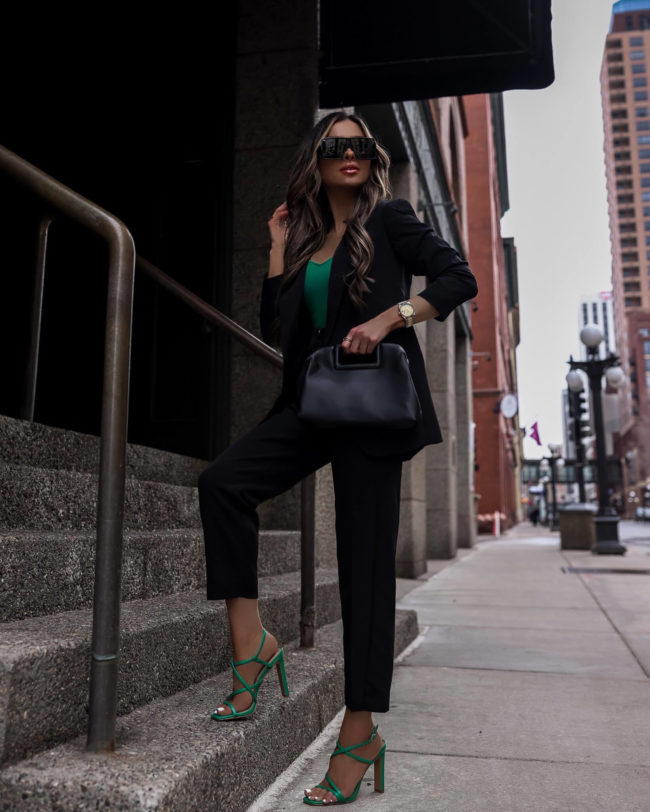 fashion blogger mia mia mine wearing green heels from express