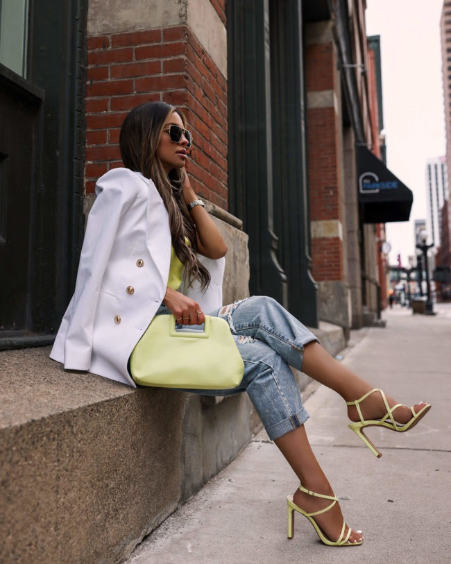 fashion blogger mia mia mine wearing neon heels from express