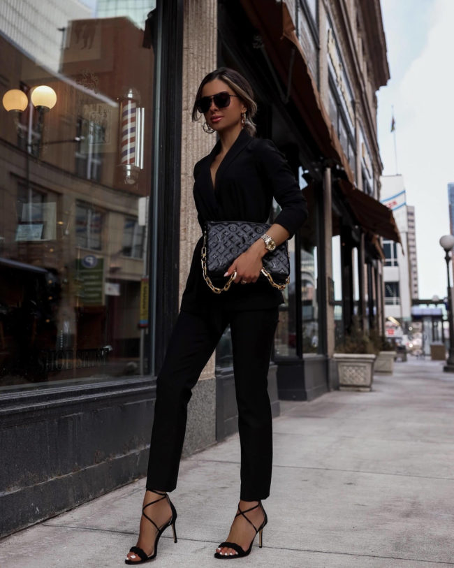 fashion blogger mia mia mine wearing a black suit and lv bag