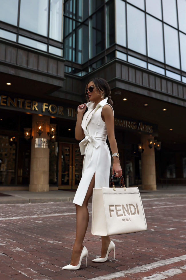 fashion blogger mia mia mine wearing a white trench dress from karen millen