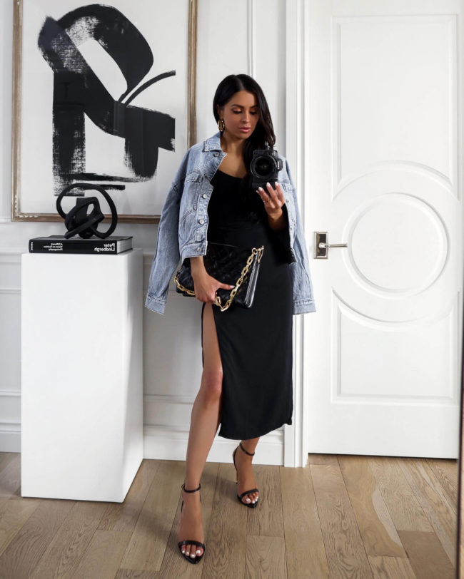 fashion blogger mia mia mine wearing a denim jacket and a black dress on sale now at abercrombie