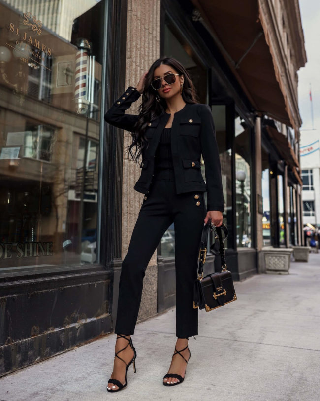 fashion blogger mia mia mine wearing a black suit from whbm