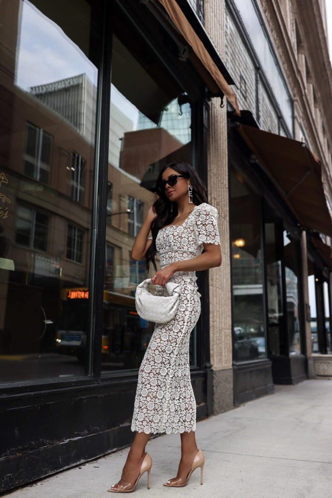 fashion blogger mia mia mine wearing a lace white dress by self portrait