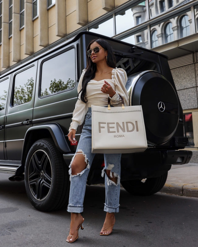 fashion blogger mia mia mine wearing agolde 90's denim and a fendi sunshine tote