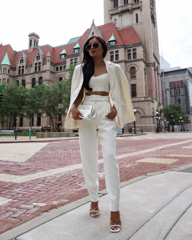 fashion blogger mia mia mine wearing a white set from express