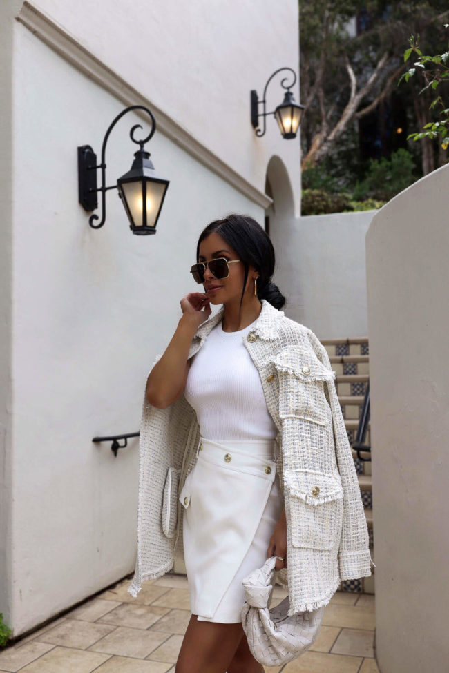 fashion blogger mia mia mine wearing a white tweed coat from karen millen
