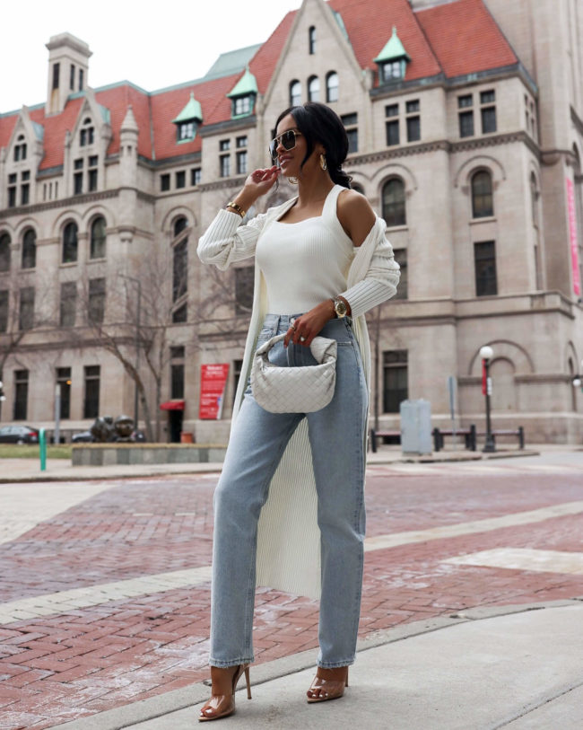fashion blogger mia mia mine wearing agolde denim and a white knit set from revolve