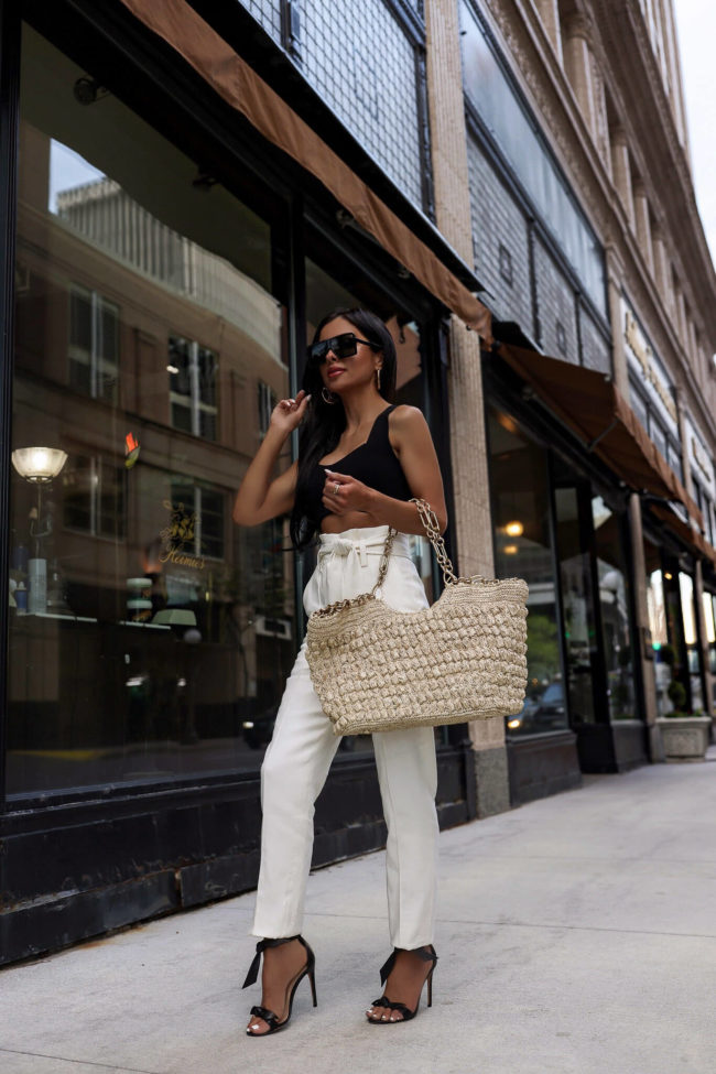 fashion blogger mia mia mine wearing white trousers by veronica beard from saks fifth avenue