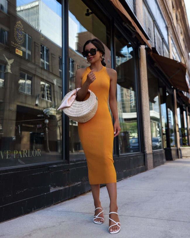 fashion blogger mia mia mine wearing a yellow knit dress by free assembly