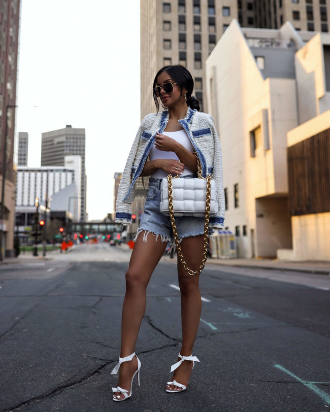 fashion blogger mia mia mine wearing moussy denim shorts from revolve