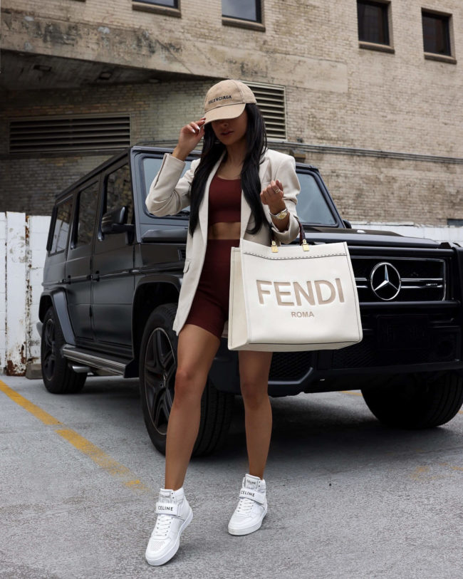 fashion blogger wearing celine high top sneakers for summer
