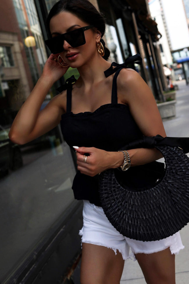 fashion blogger mia mia mine wearing a black tie strap top from walmart