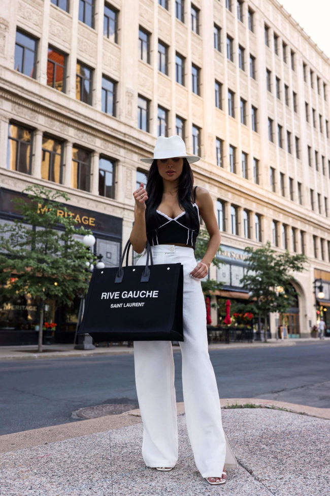 fashion blogger mia mia mine wearing white linen pants and a white fedora hat from nordstrom