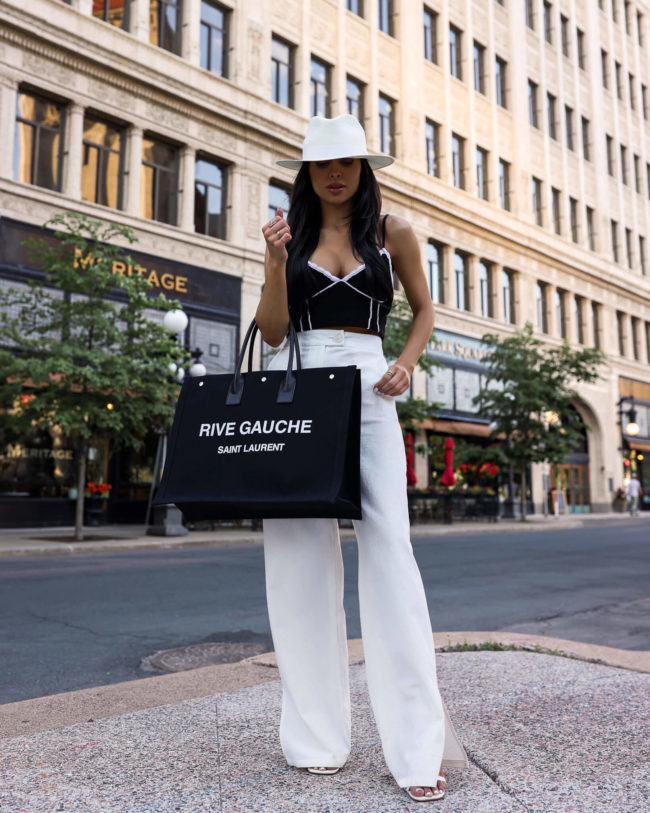 fashion blogger mia mia mine wearing white linen pants and a white fedora hat from nordstrom