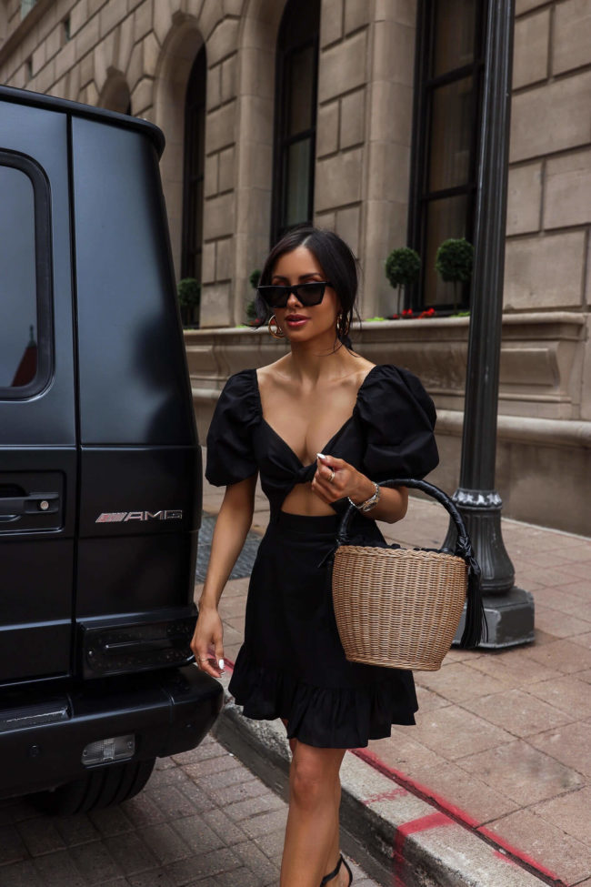 fashion blogger mia mia mine wearing a black astr the label dress from saks fifth avenue