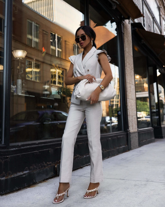 fashion blogger mia mia mine wearing a white linen suit from whbm