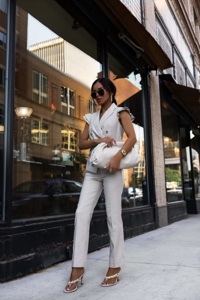 fashion blogger mia mia mine wearing a white linen suit from whbm