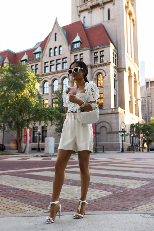 fashion blogger wearing a white summer outfit from bloomingdale's
