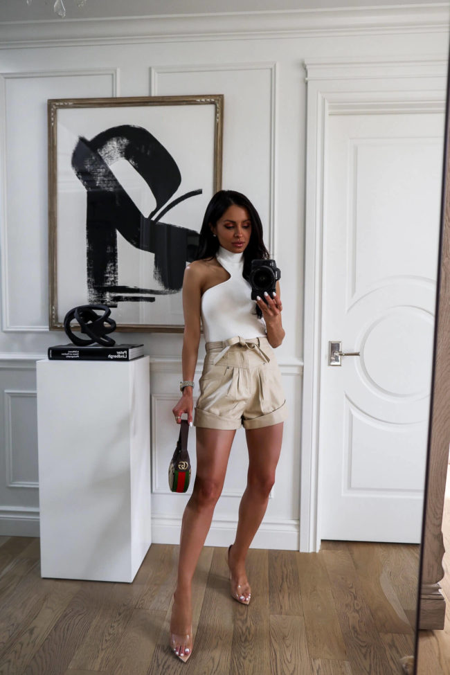 fashion blogger mia mia mine wearing ivory leather shorts from revolve