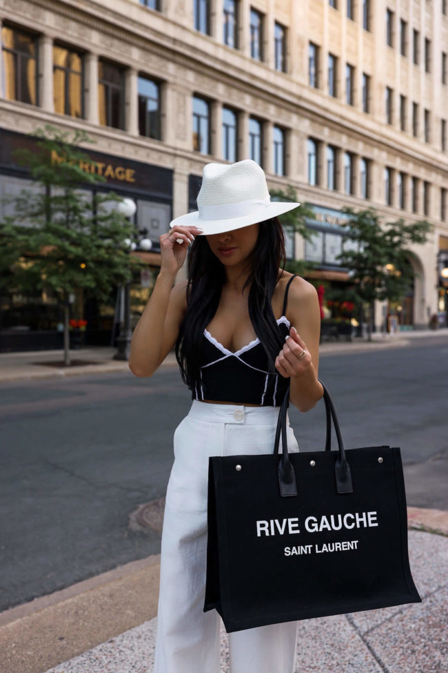 fashion blogger mia mia mine wearing a saint laurent rive gauche canvas tote