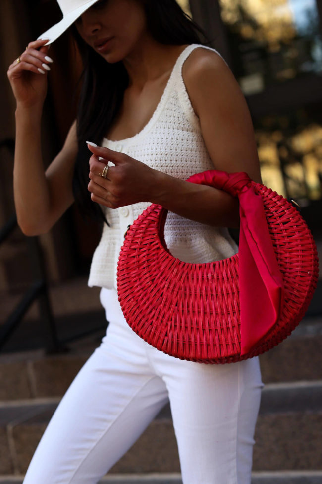 fashion blogger mia mia mine wearing a red straw bag from walmart