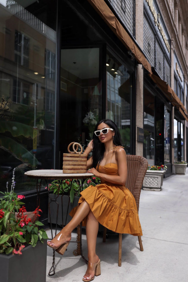 fashion blogger mia mia mine wearing schutz heels and a staud summer dress from saks
