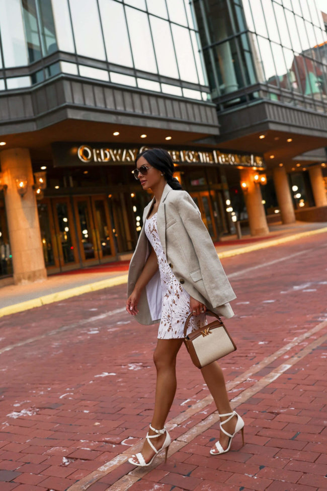 brunette fashion blogger wearing a white slip dress from michael kors