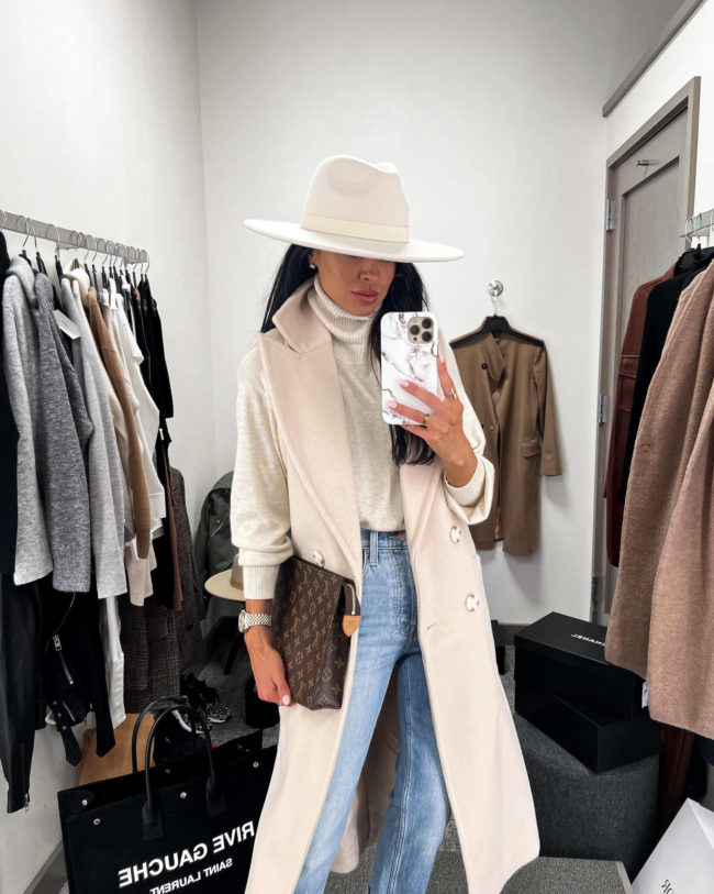 fashion blogger mia mia mine wearing a white vest from the nordstrom anniversary sale 2022