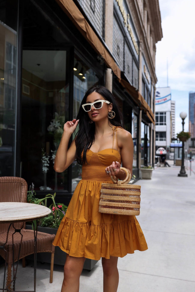 brunette fashion blogger wearing a summer dress from saks