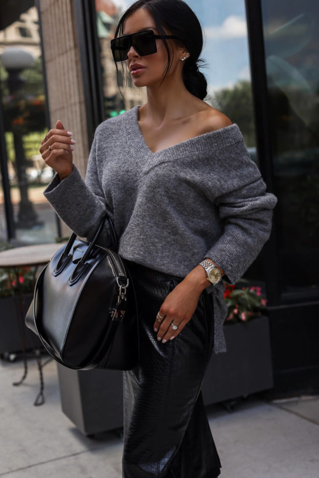 fashion blogger wearing a grey cashmere sweater and leather skirt from the nsale 2022