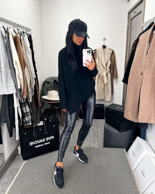 fashion blogger mia mia mine wearing a black all saints sweater from the nordstrom anniversary sale 2022