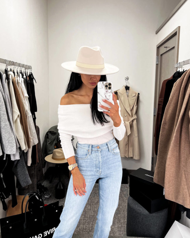 fashion blogger mia mia mine wearing a white off the shoulder top from the nordstrom anniversary sale