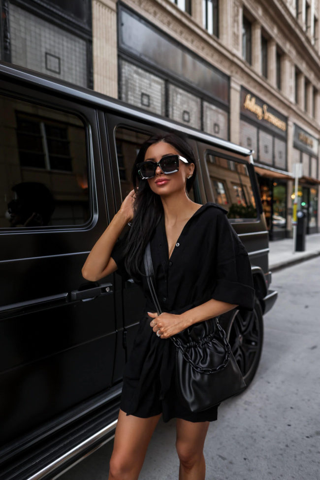 fashion blogger wearing a black crossbody bag from walmart