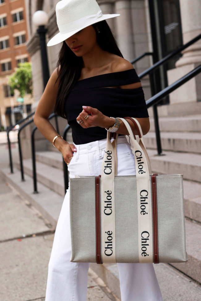 fashion blogger mia mia mine wearing a black bodysuit by agolde