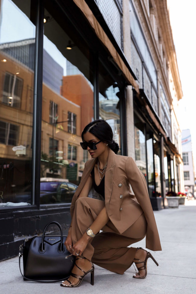 fashion blogger mia mia mine wearing a camel suit from whbm