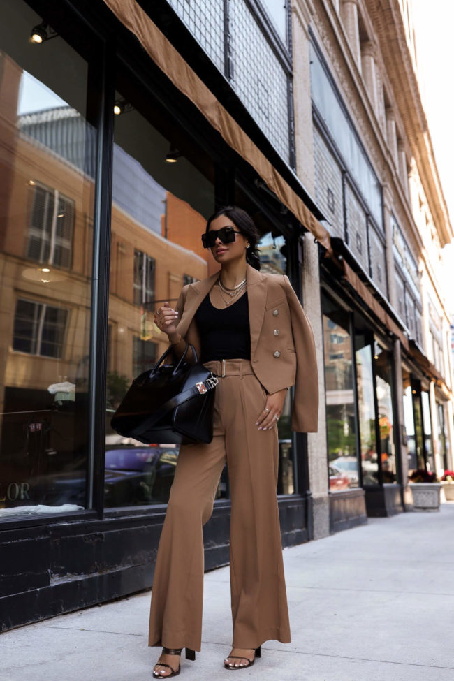 fashion blogger mia mia mine wearing camel trousers from whbm