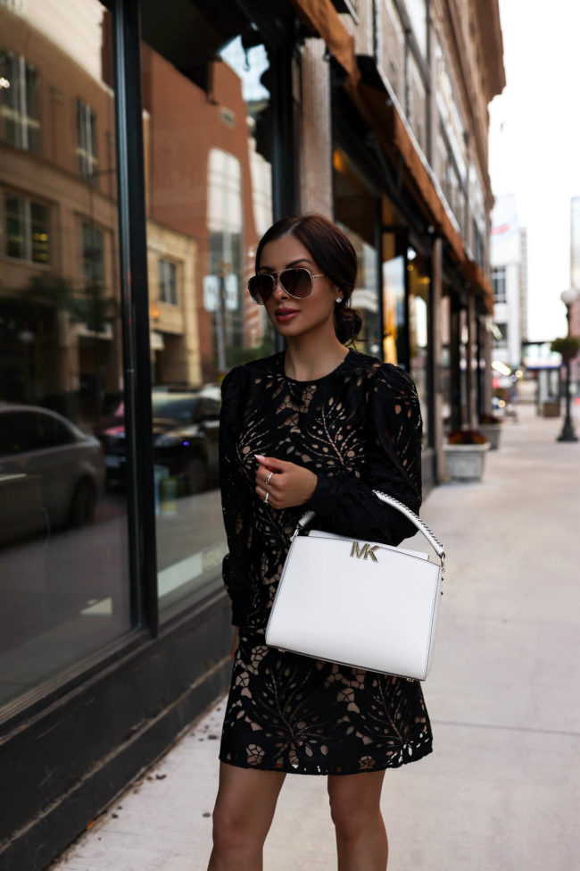 fashion blogger mia mia mine wearing a black lace dress by michael kors