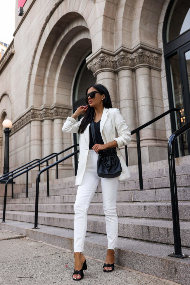 fashion blogger mia mia mine wearing white jeans and a white blazer from walmart's free assembly line