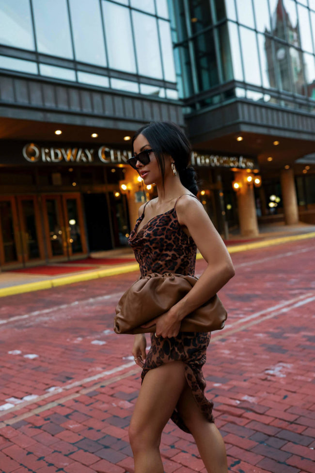 fashion blogger mia mia mine wearing a black halter dress from nordstrom