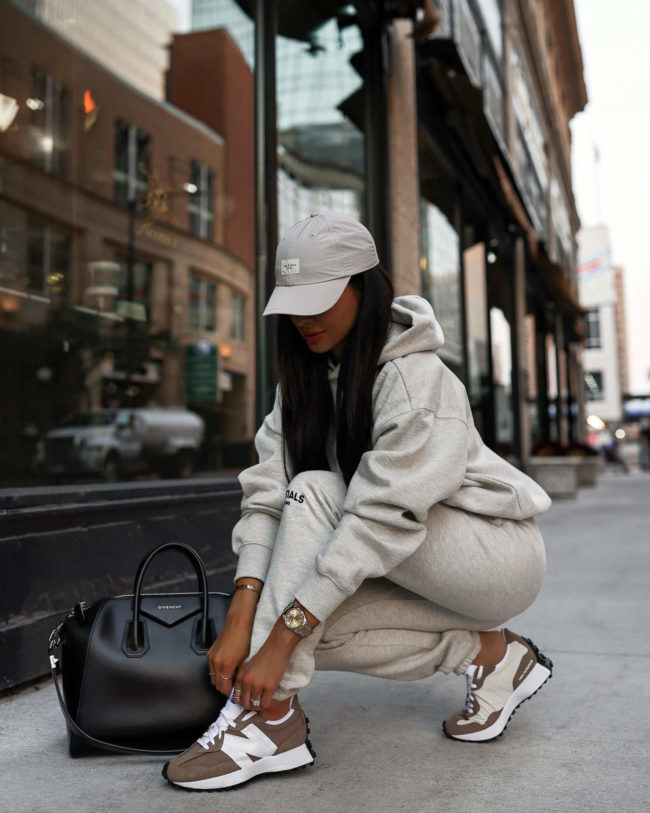 fashion blogger mia mia mine wearing new balance sneakers and an essentials sweatsuit from ssense