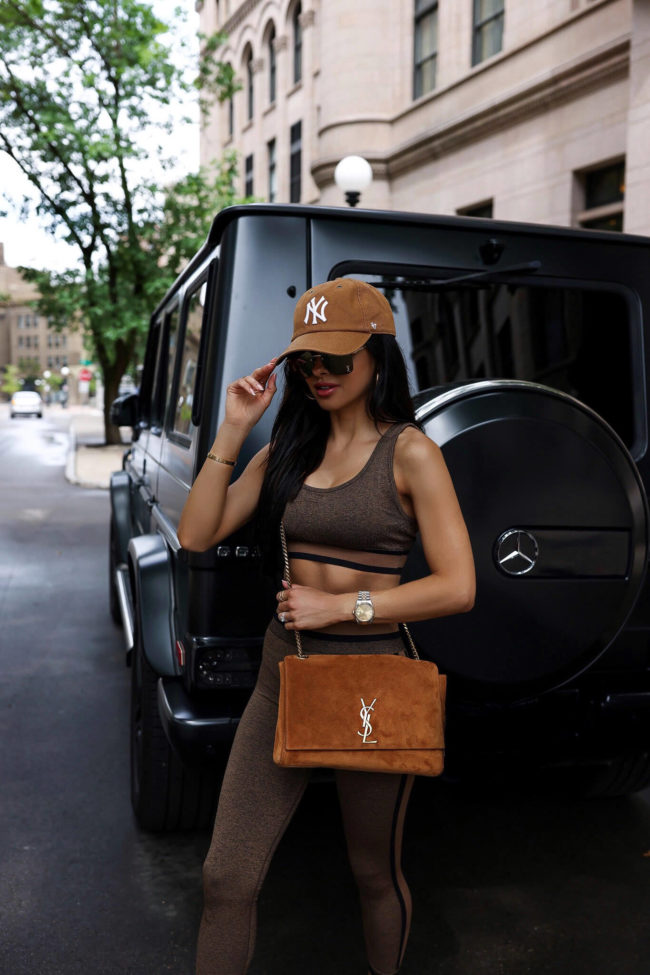 fashion blogger mia mia mine wearing a suede brown bag by ysl