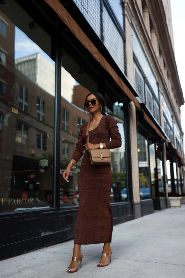 fashion blogger mia mia mine wearing a knit dress and saint laurent bag from saks