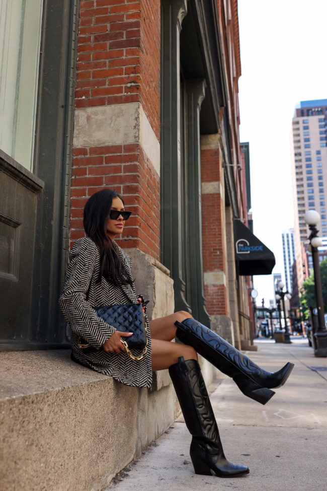 fashion blogger mia mia mine wearing isabel marant cowboy boots from mytheresa and a louis vuitton coussin bag