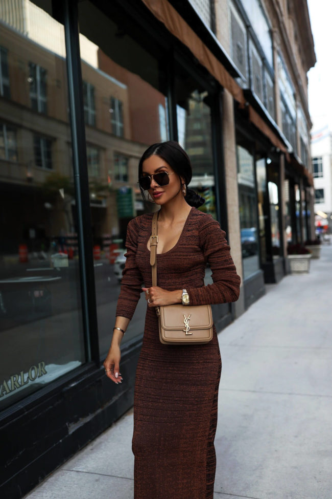 fashion blogger mia mia mine wearing a red knit dress for fall