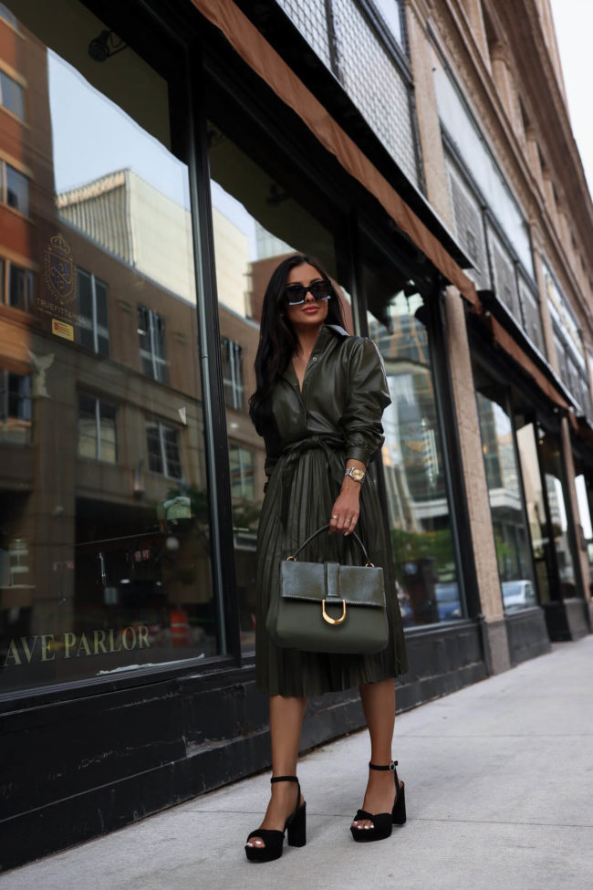 fashion blogger mia mia mine wearing a walmart faux leather shirt dress