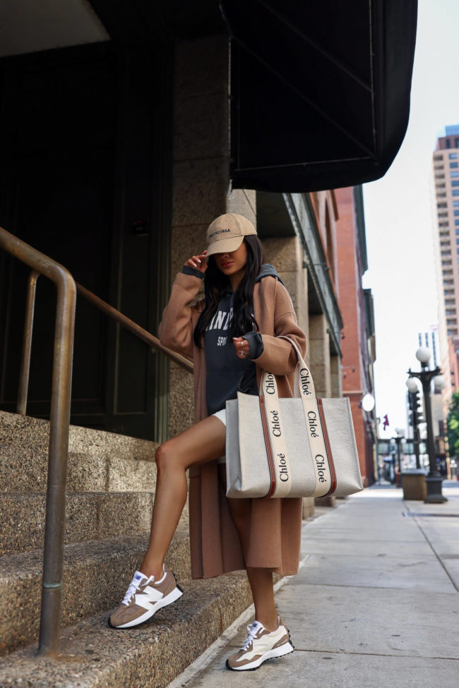 fashion blogger wearing a mango coatigan and new balance 327 sneakers