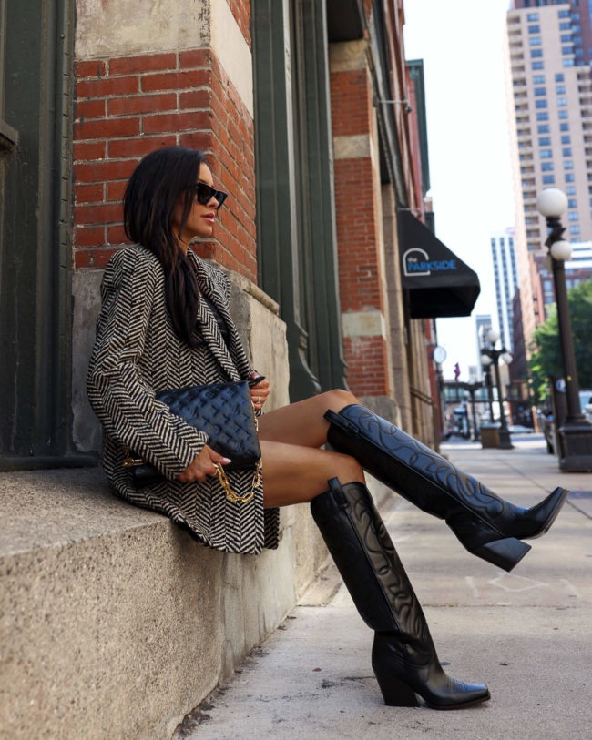 fashion blogger mia mia mine wearing isabel marant cowboy boots and an anine bing chevron blazer