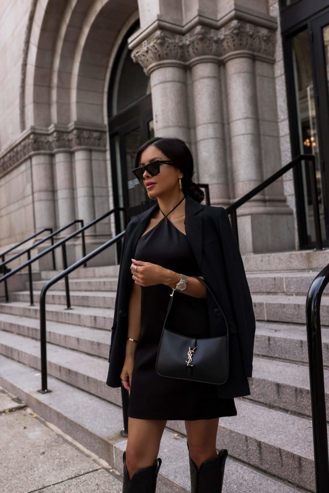 fashion blogger wearing a black halter dress by alice + olivia from nordstrom
