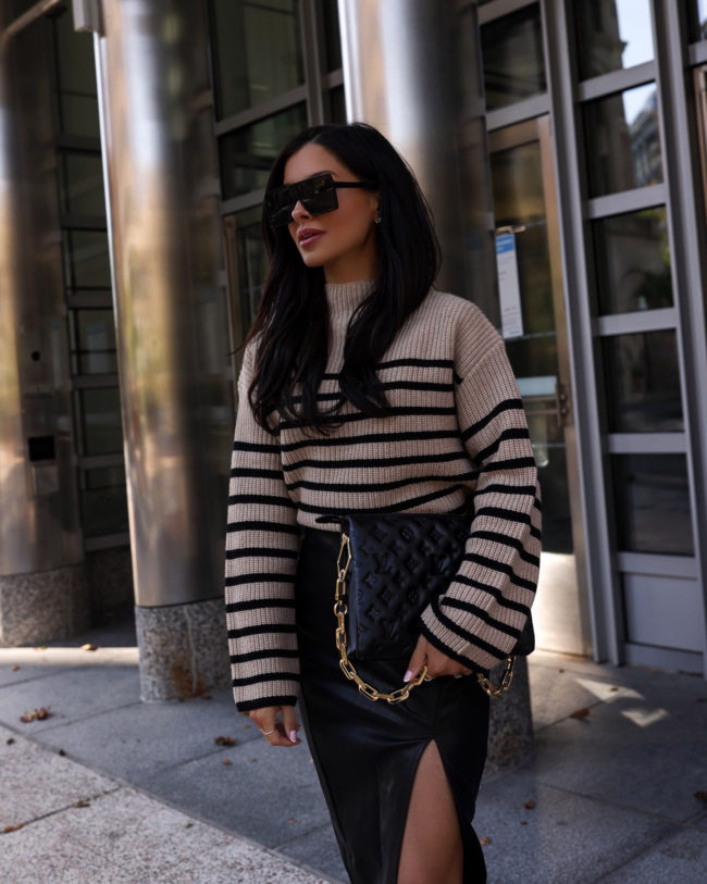 fashion blogger mia mia mine wearing a rails stripe sweater and leather skirt